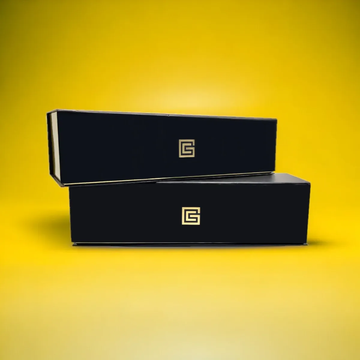 Black rigid boxes with a gold foil stamped monogram