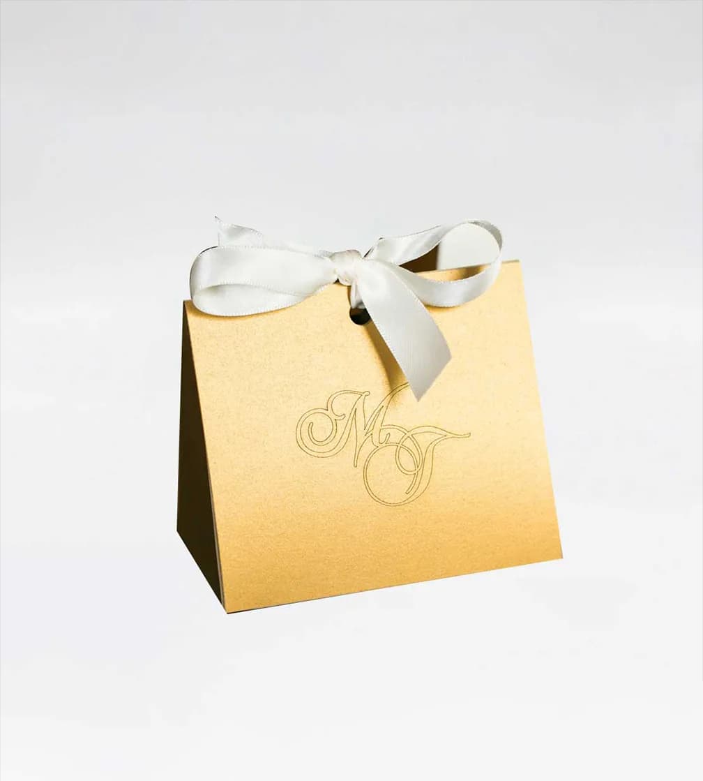 Gold pearlescent favour box with a satin bow