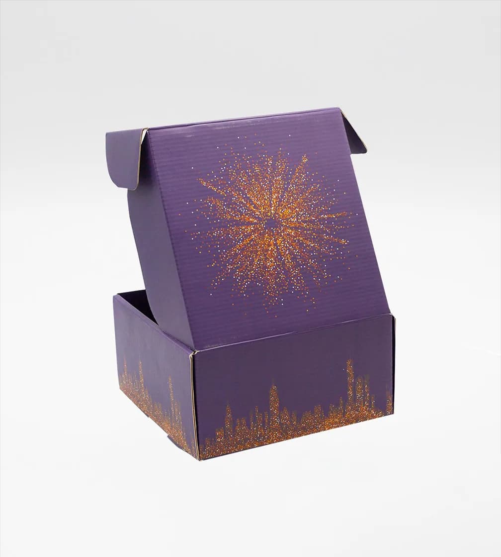 Purple mailer standing open, sunburst print inside the lid