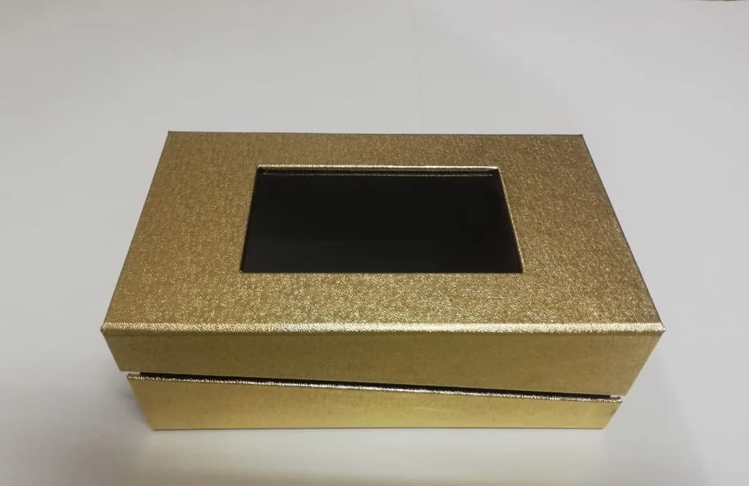 Textured metallic wrap on a two-piece box