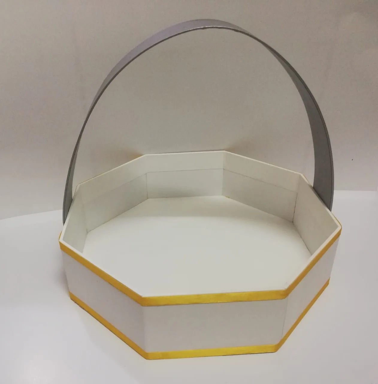 Octagonal rigid tray with arched handle