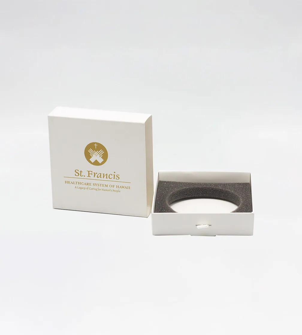 White rigid box, lid lifted, foam insert