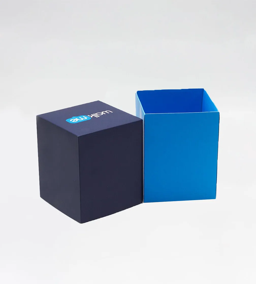 Navy two-piece rigid cube box with the lid beside the base