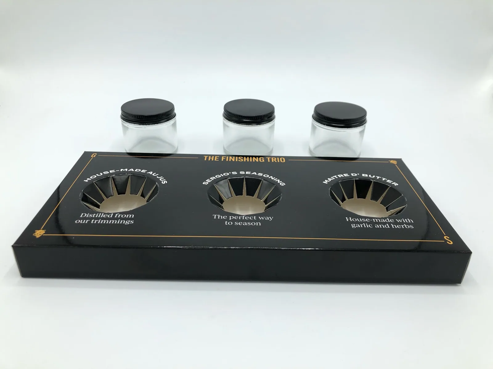 Glossy black display tray with die-cut jar holes
