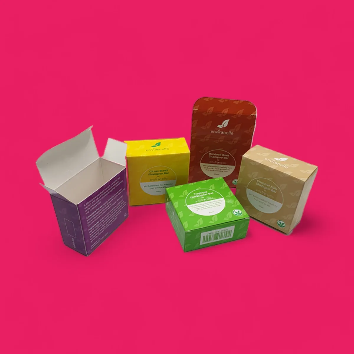 Four small printed cartons in purple, green, orange and cream